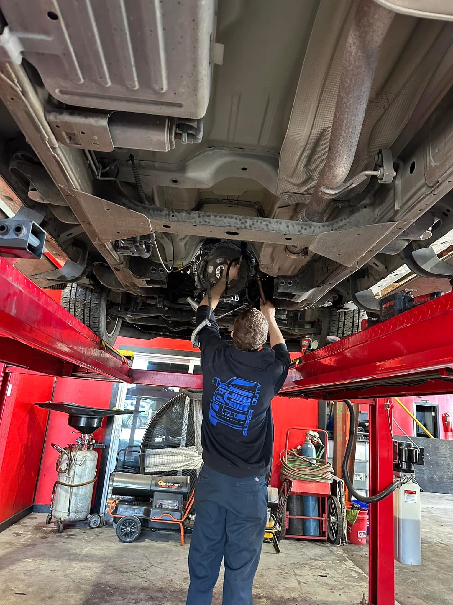 KT Diesel Services technician performing undercarriage repair